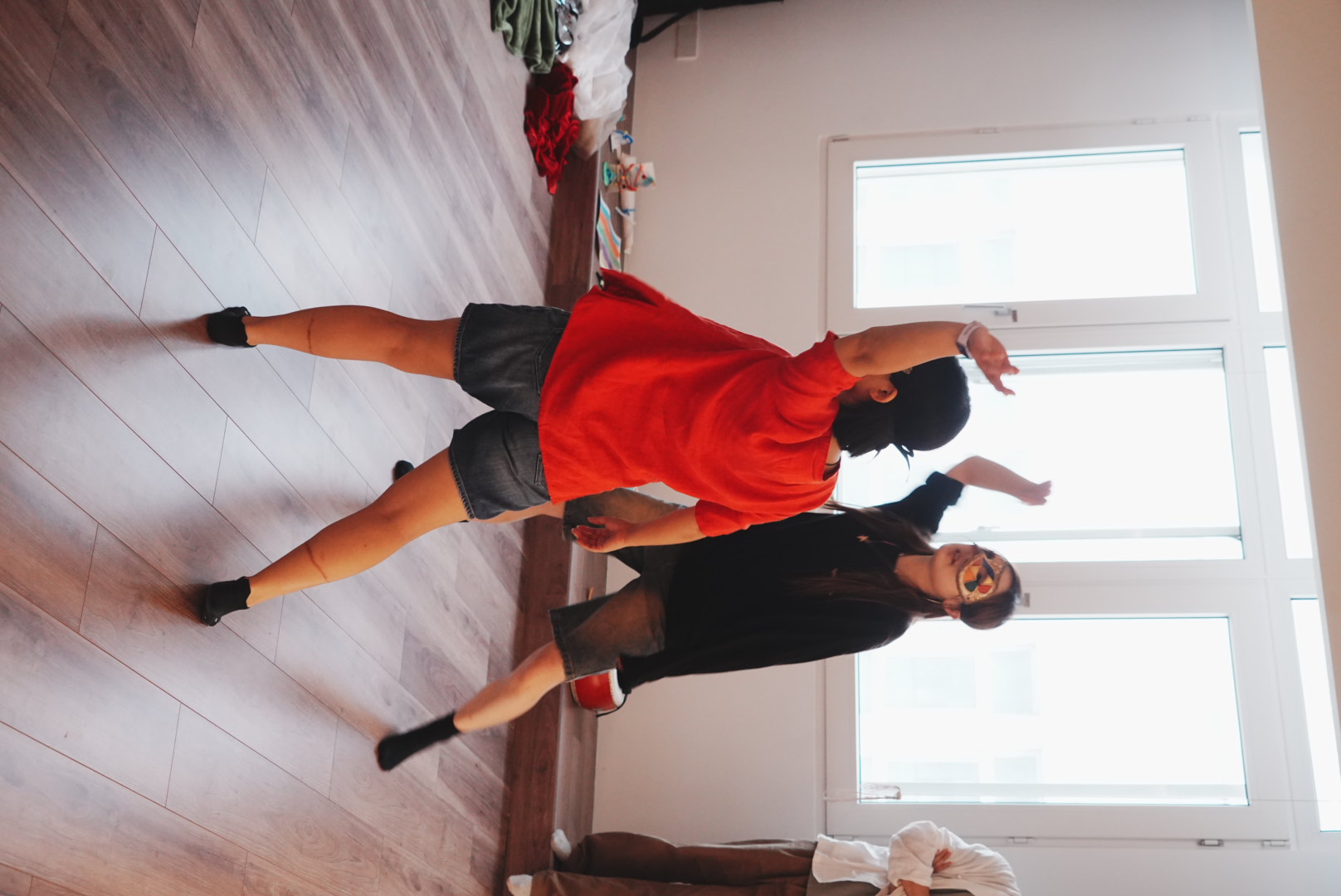 Participants using masks and movement in an improvisational exercise