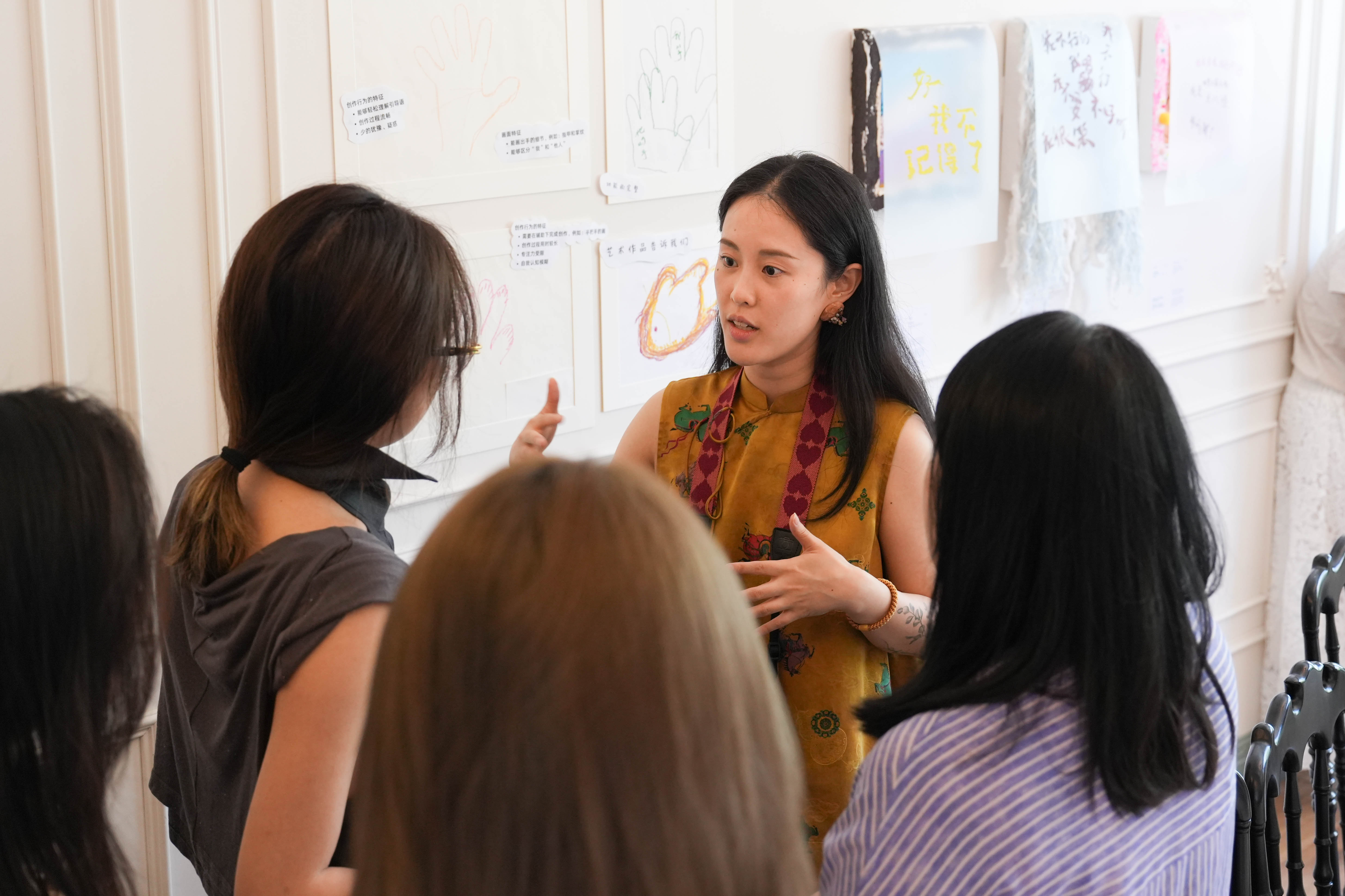 A facilitator leading reflective dialogue with a small learning group